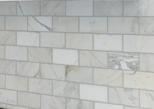 Marble subway tile splashback provides contrast in a Hamptons style kitchen renovation in Castle Hill