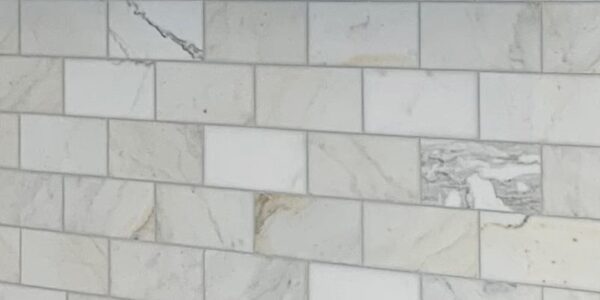 Marble subway tile splashback provides contrast in a Hamptons style kitchen renovation in Castle Hill