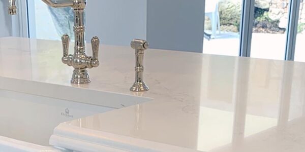 Polished nickel hardware in Hamptons kitchen renovation in Castle Hill