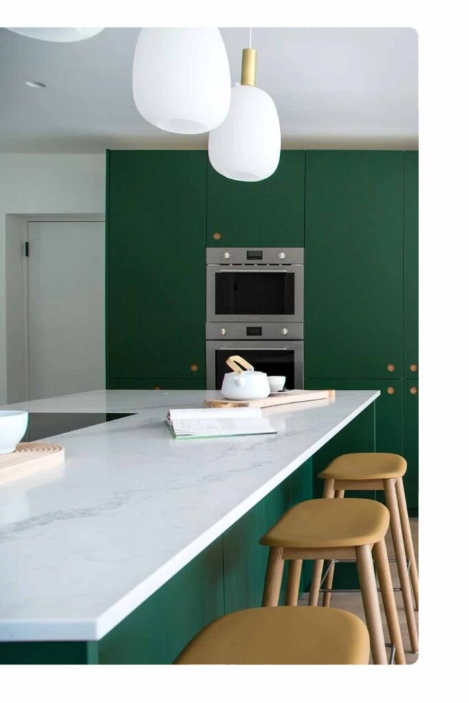 Luxury marble kitchen benchtop Sydney paired with green cabinetry and warm timber accents by Badel Kitchens