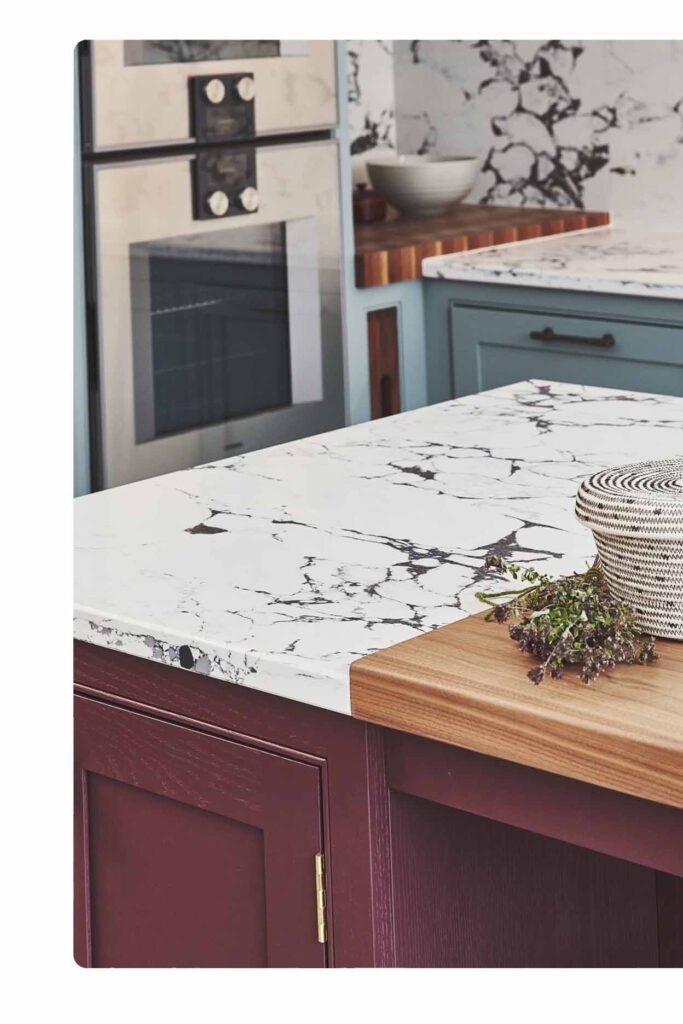 Stone kitchen benchtop Sydney with marble surface, timber insert and stylish cabinetry design by Badel Kitchens