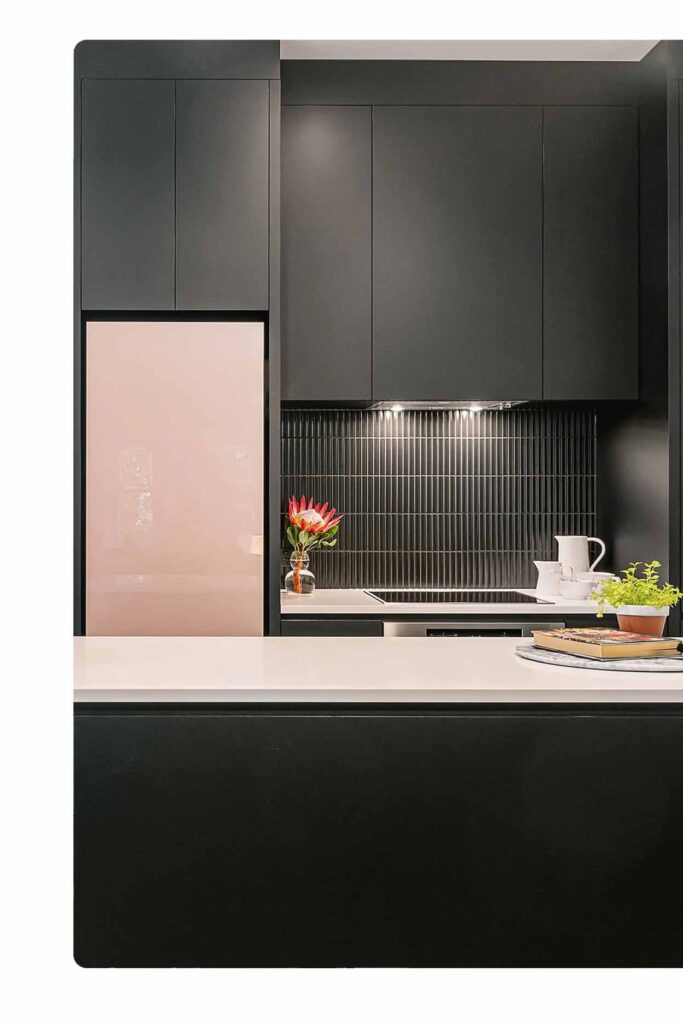 Stone kitchen benchtop Sydney with sleek white surface and contemporary black kitchen design