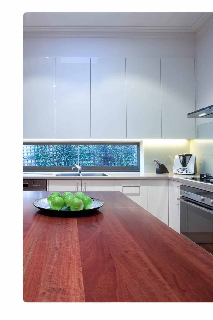 Custom kitchen benchtop Sydney handcrafted in rich timber with seamless cabinetry and soft LED lighting – Badel Kitchens