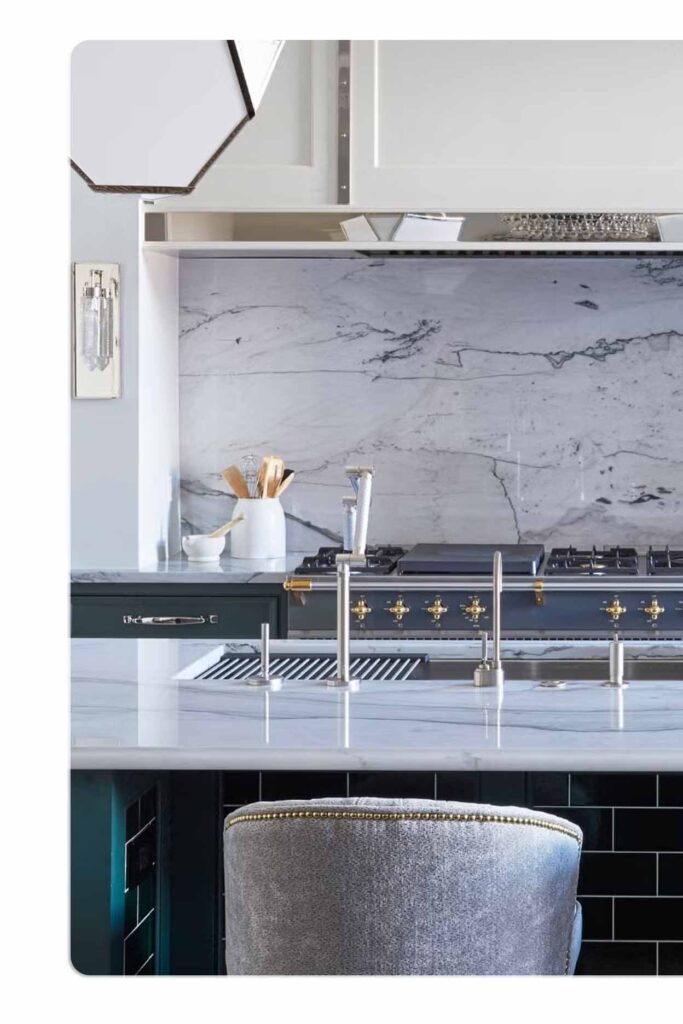 Luxury kitchen design with marble splashback, integrated cooktop, and brushed metal fixtures — custom Sydney kitchen by Badel Kitchens & Joinery.