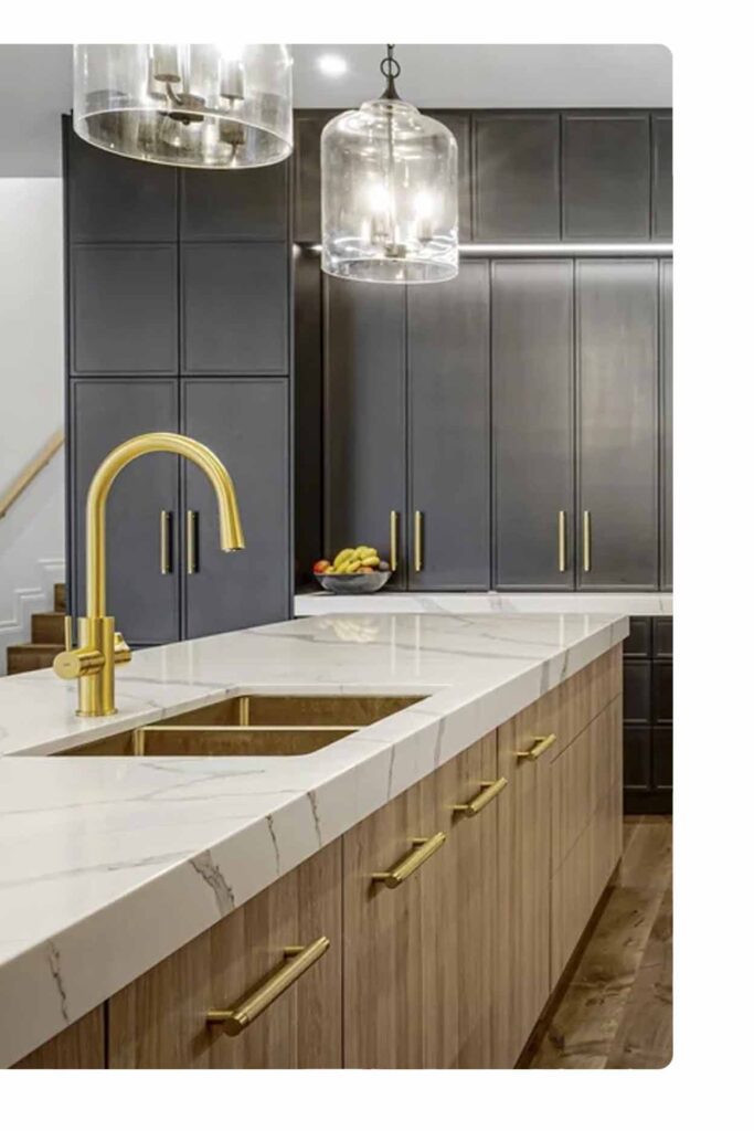 Custom kitchen design Sydney featuring dark cabinetry, marble benchtop, and brushed gold tapware and handles.