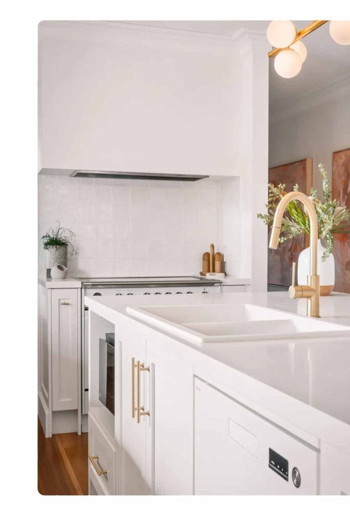 White kitchen layout Sydney with gold tapware and shaker cabinetry by Badel Kitchens