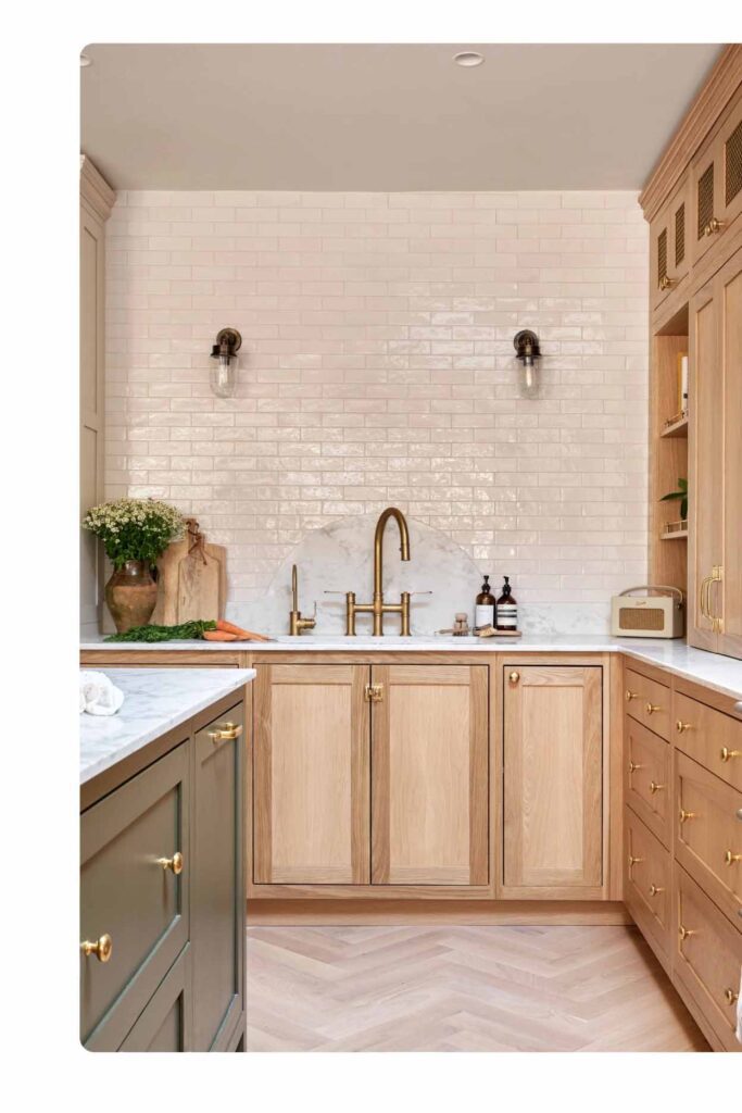 Classic white subway tile kitchen splashback with oak cabinetry and brass tapware by Badel Kitchens Sydney