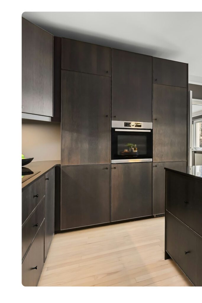 Contemporary kitchen renovation in Sydney’s Eastern Suburbs with timber accents and soft lighting.