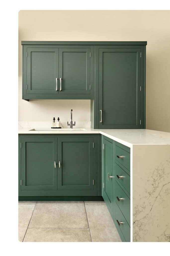 Elegant kitchen layout Sydney homeowners love — green cabinetry with white marble benchtop